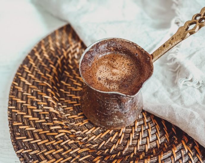 Brown Ceramic Mug on Brown Woven Round Table