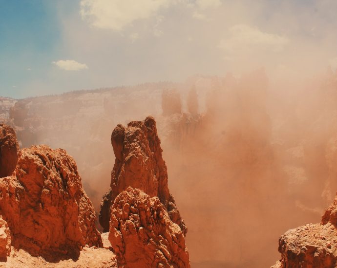 Sand Storm And Rock Formation