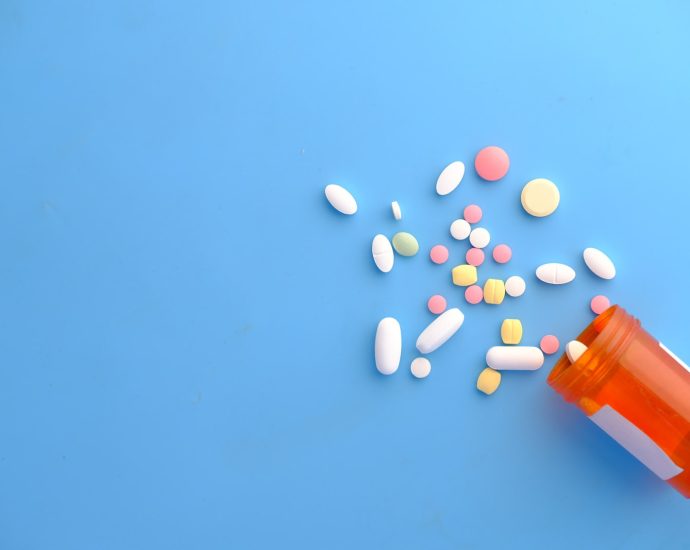 orange and white medication pill