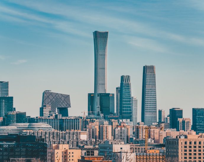 city skyline under blue sky during daytime