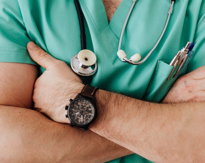 Crop unrecognizable male doctor with stethoscope