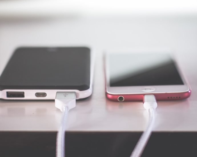 two phones on white table