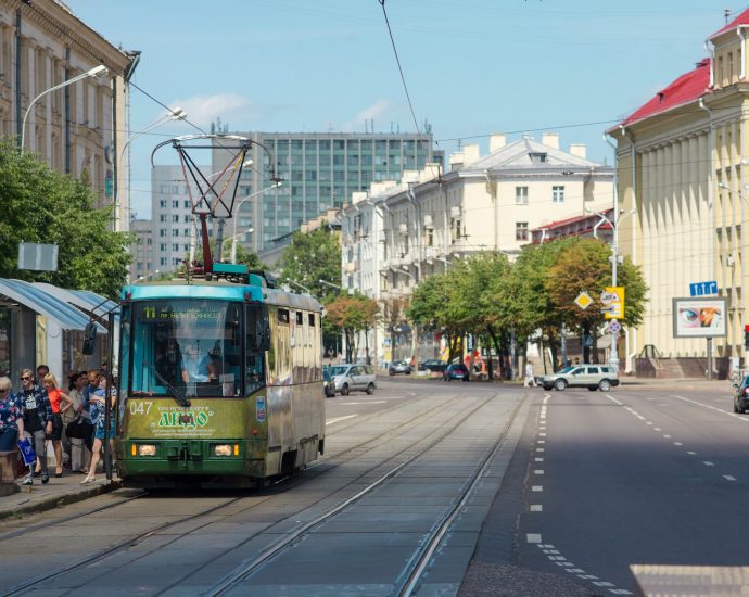 yellow and white tram on road during daytime