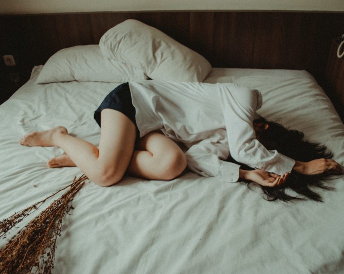 woman lying on bed