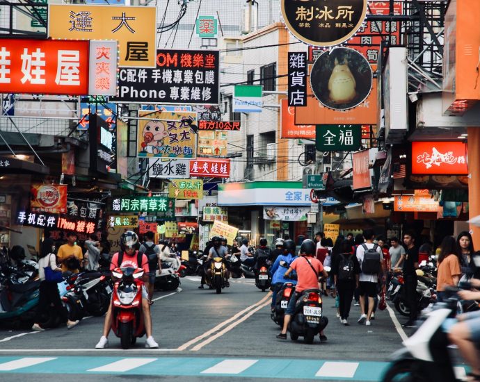 people riding motorcycle on road during daytime