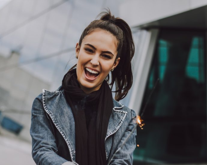 woman wearing gray denim jacket and black scarf