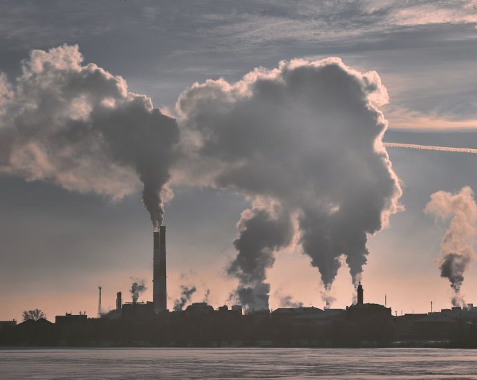 silhouette of building under white clouds during daytime