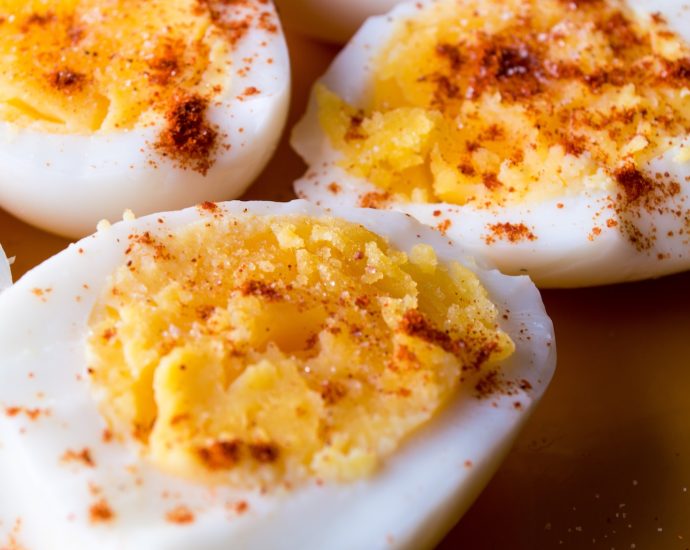 sliced boiled eggs topped with spices