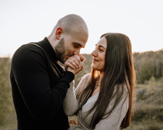 Man Kissing Woman Hands