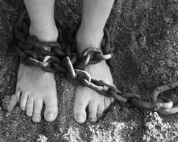 chains, feet, sand