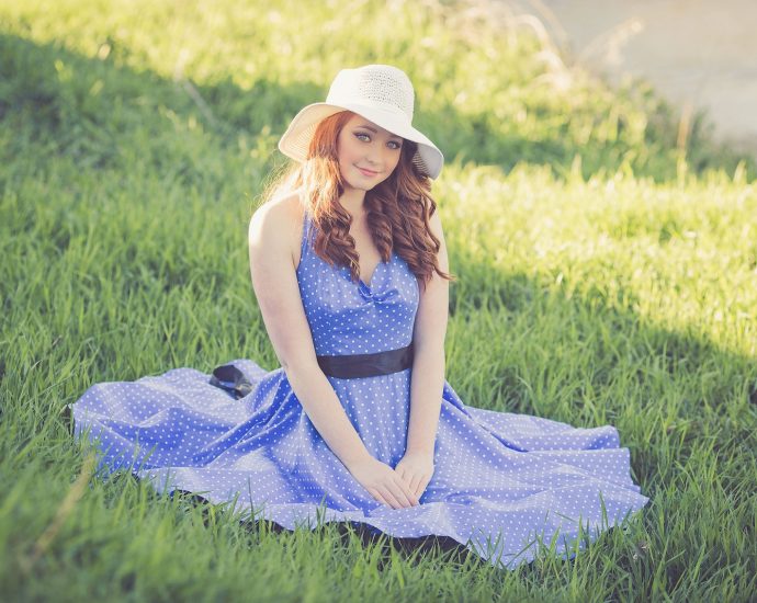 Portrait of a Smiling Young Woman in Grass