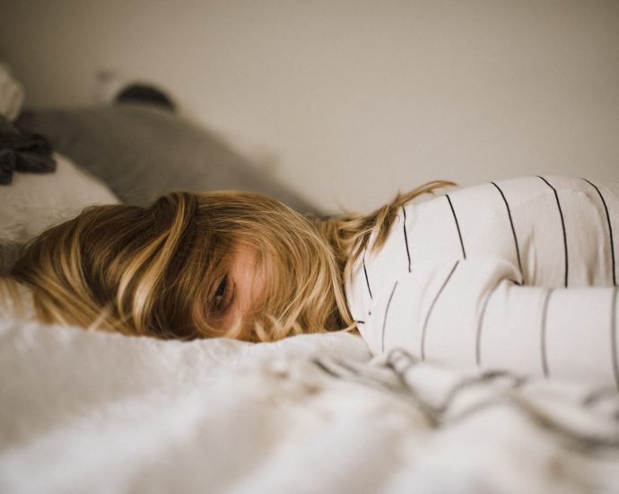 woman lying on bed