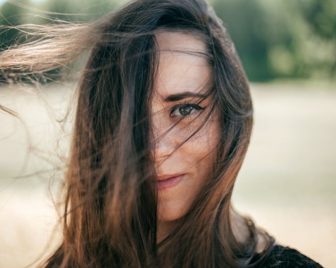 a close up of a woman with long hair