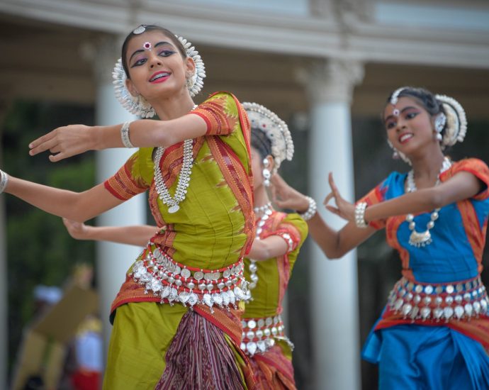 three woman performing traditional dance