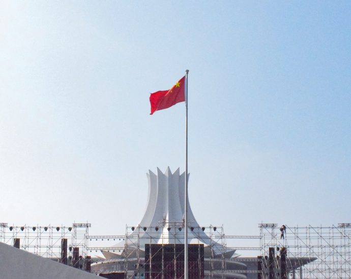 red white and blue flag on pole during daytime