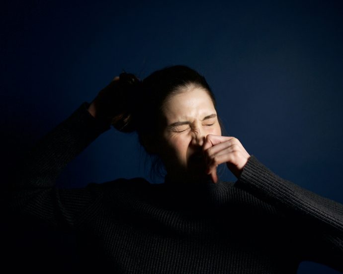 Woman Touching Her Nose