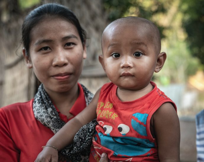 woman holding toddler