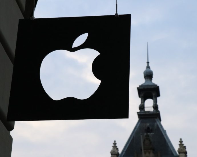 Apple logo in front of a building