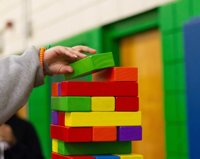 person piling blocks