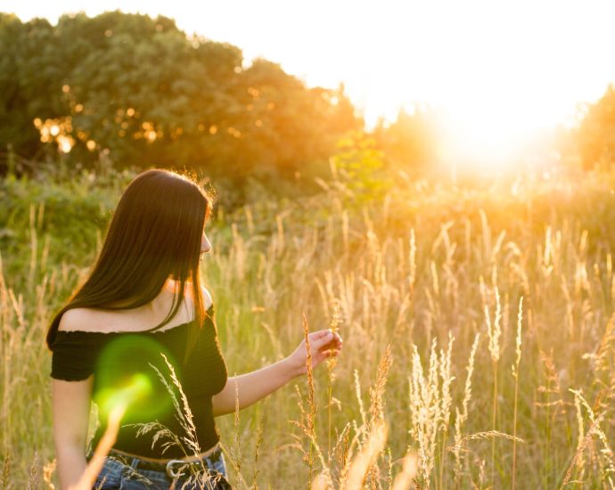 woman walking on grass