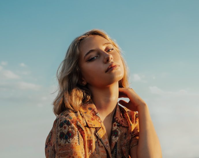 woman in brown and black floral button up shirt