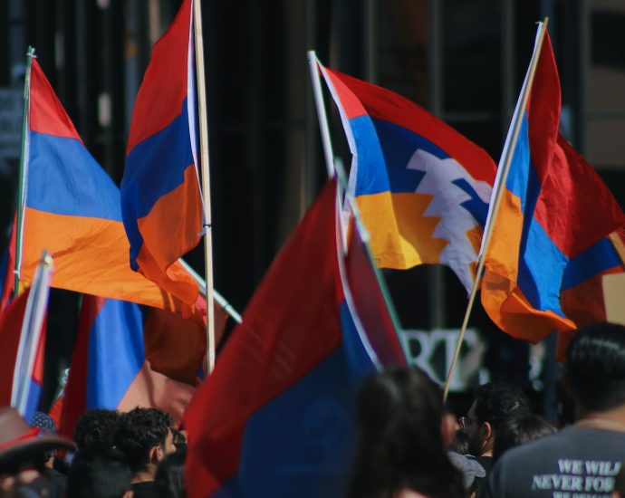 a group of people holding flags