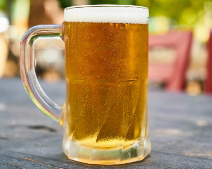 Beer Filled Mug on Table