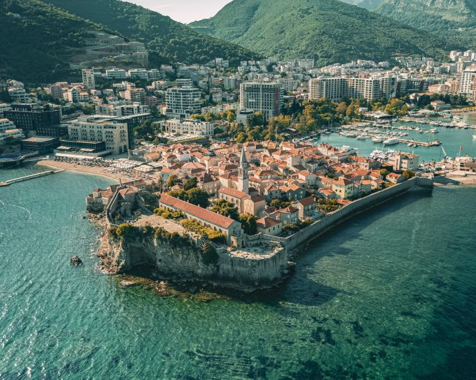 Aerial Photography of Buildings Near Body of Water