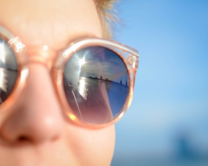 woman wearing brown framed sunglasses