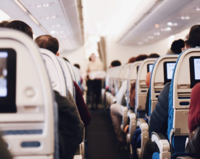 shallow focus photography of people inside of passenger plane