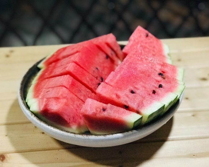 slices of watermelon in a bowl on a table