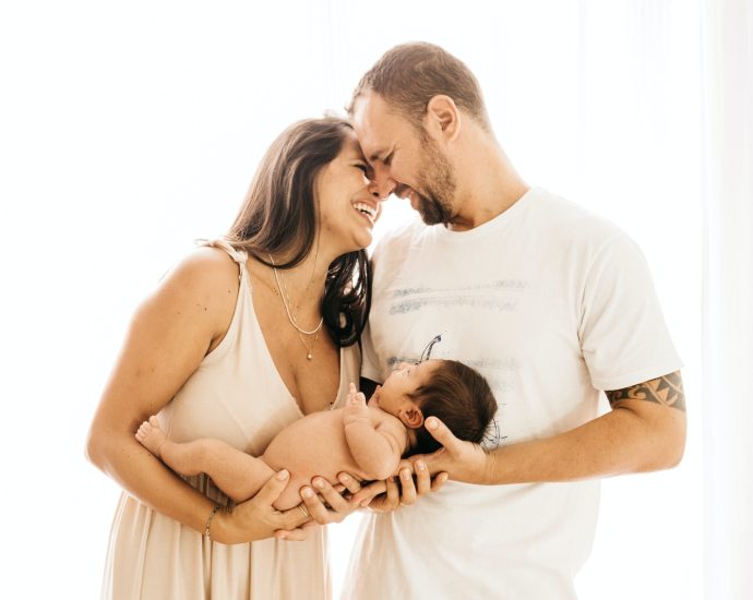 man in white crew neck t-shirt kissing woman in white dress