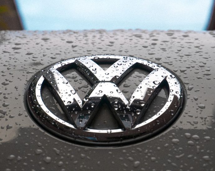 water dew on silver Volkswagen car emblem