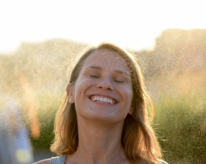 woman in white shirt smiling