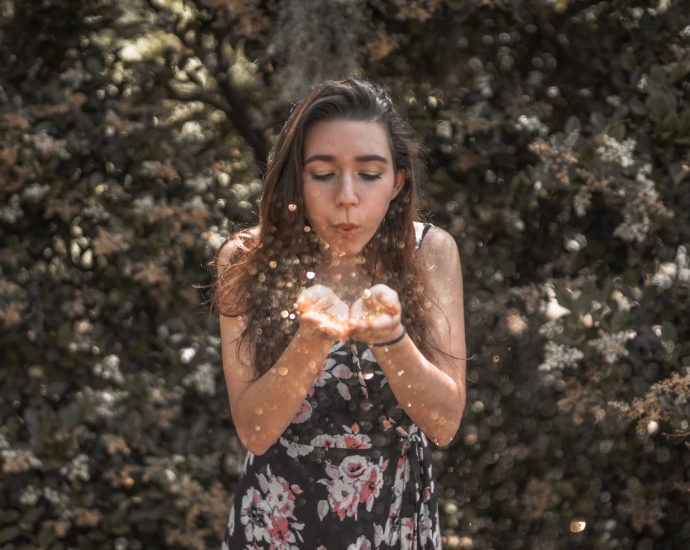 woman blowing her hands