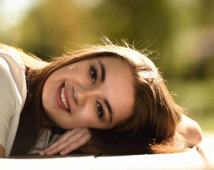 Close Up Photography of Woman Laying on Table