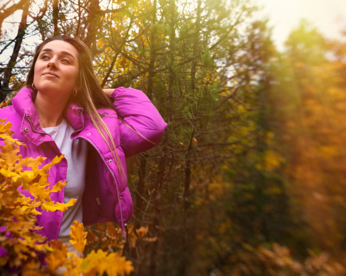 a woman standing in a garden