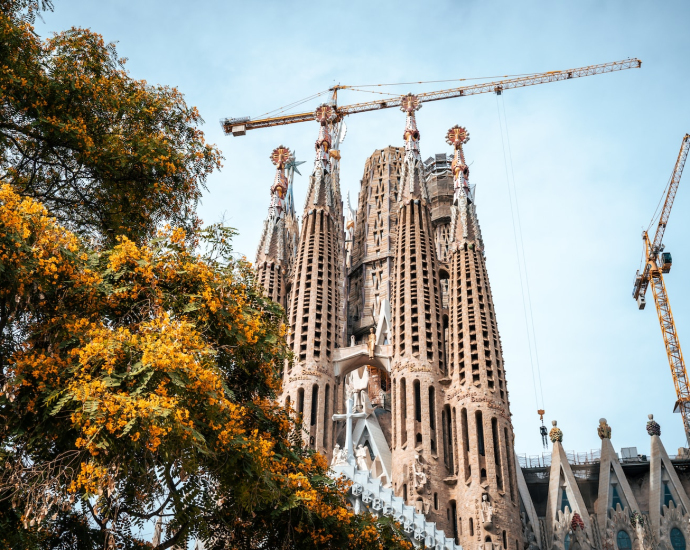 a very tall building with a crane on top of it