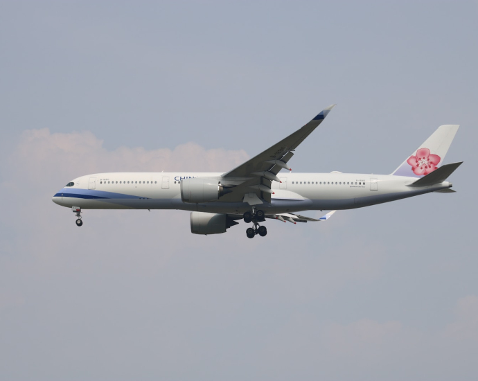 a large airplane flying in the sky