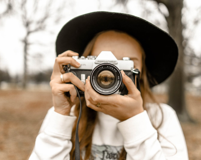 Selective Focus Photography of Woman Using White and Black Slr Camera