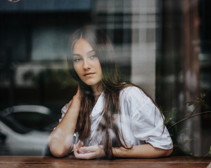 woman posing for photo inside store