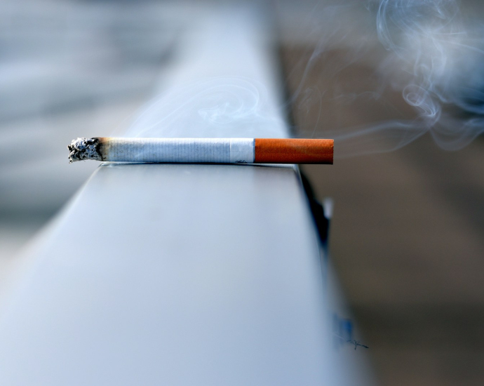 white cigarette stick on white wall