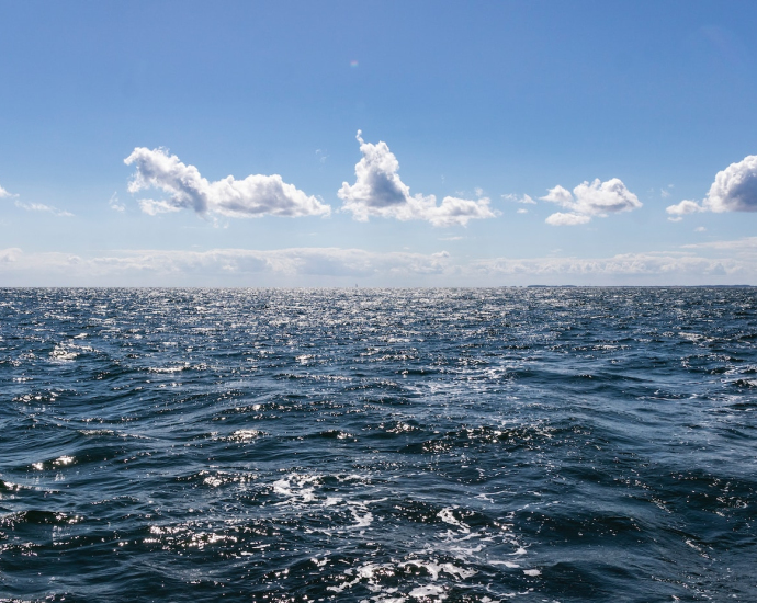 blue ocean under blue sky during daytime