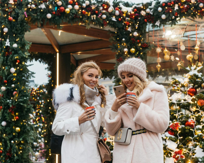 Two Women Near Christmas Decorations