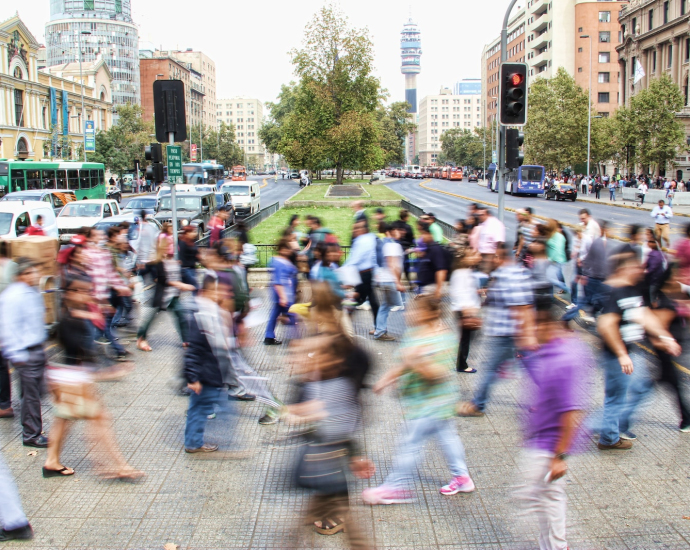 timelapse photo of people passing the street