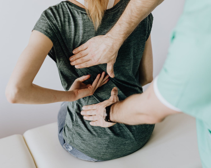 Doctor Examines Woman's back