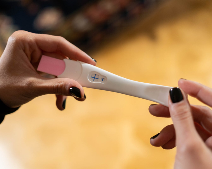 Hands Holding Pregnancy Test Kit