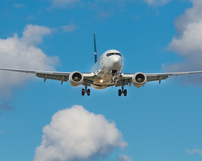 white airplane on mid air