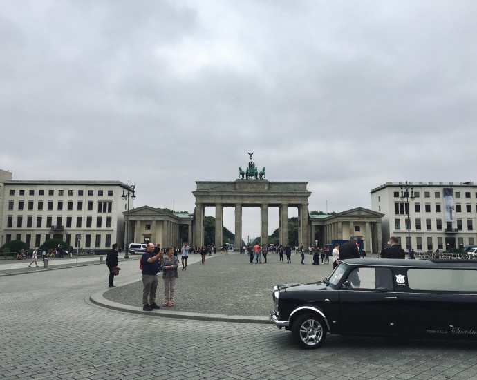 a black car parked in front of a building