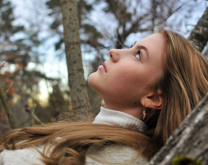 a person with the hair blowing in the wind